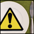 Yellow ALERT sign on a plate